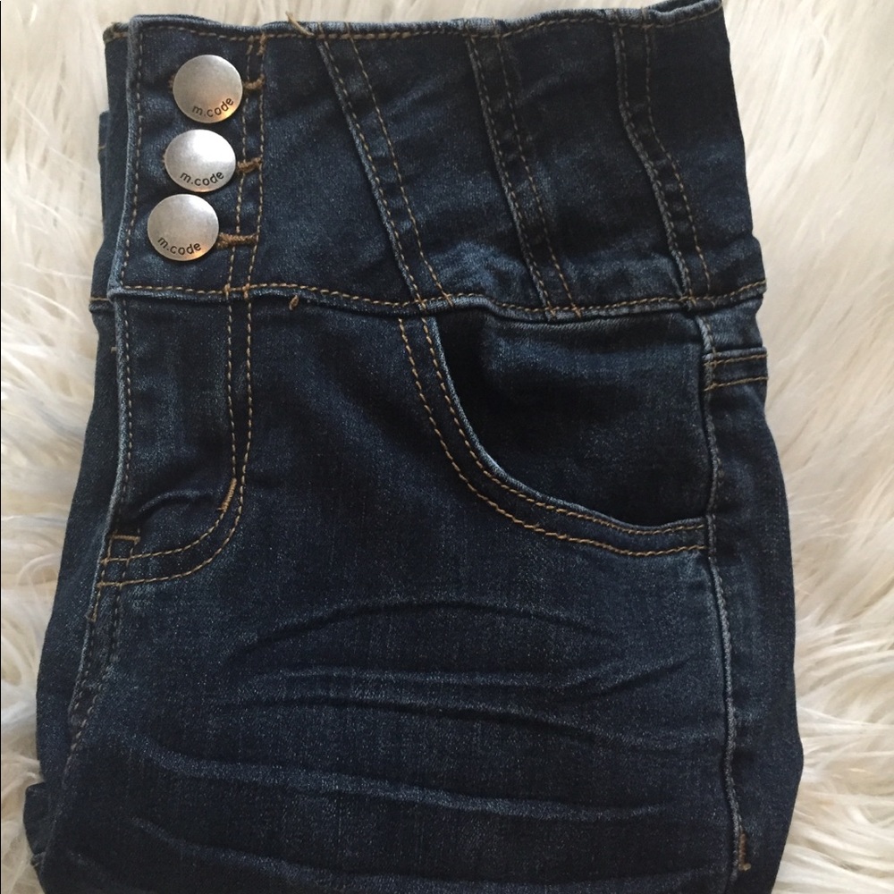 Dark denim blue jeans; high waisted